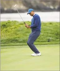  ?? Marcio Jose Sanchez / Associated Press ?? Tiger Woods reacts after missing a putt on the 17th hole during the second round of the U.S. Open on Friday in Pebble Beach, Calif.