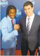  ?? JAMES LANG/USA TODAY 2012 ?? Robert Griffin III, left, was the second overall pick in the 2012 NFL draft behind Andrew Luck, right. Luck abruptly retired Saturday.