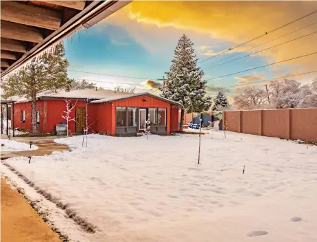  ?? COURTESY PHOTO ?? Freshly-fallen snow coats the courtyard where fruit trees have been planted.