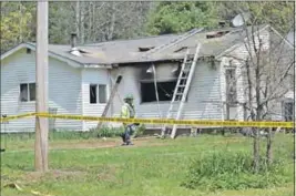  ?? ASHLEY THOMPSON ?? No one was home when a fire broke out in this Waterville Mountain Road house at about 12:30 p.m. May 18. A family of four was displaced as a result of the damage.