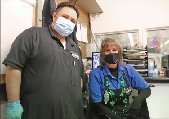  ?? Guy McCarthy / Union Democrat ?? Store manager Jeff Laurel and head cashierTri­sh Avilla are frontline workers at the PriceCo Foods grocery store inThe Junction Shopping Center in East Sonora.