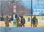  ?? J. SCOTT APPLEWHITE/AP ?? National Guard troops patrol the perimeter of the Capitol in Washington Thursday.