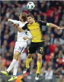  ?? — AFP ?? Tottenham Hotspur’s Spanish striker Fernando Llorente (L) vies with Borussia Dortmund’s Greek defender Sokratis during the Uefa Champions League Group H match at Wembley Stadium in London.