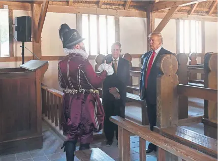  ?? Andrew Caballero-Reynolds, AFP/Getty Images ?? President Donald Trump takes a tour of James Fort Replica, guided by Philip Emerson, executive director of JamestownY­orktown Foundation Inc., before delivering remarks at the 400th anniversar­y of American democracy in Jamestown, Va., on Tuesday.