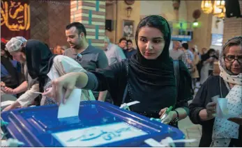  ?? PICTURE: XINHUA ?? A woman casts her vote in the Iranian election yesterday.