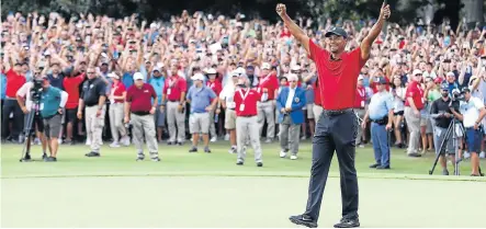  ?? BRADBURY/GETTY IMAGES/AFP Picture: TIM ?? EARNING HIS STRIPES: Tiger Woods of the US celebrates making a par on the 18th green to win the Tour Championsh­ip at East Lake Golf Club in Atlanta, Georgia on Sunday.