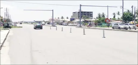  ??  ?? A section of the four-lane highway at Lusignan showing the installed traffic light supports at the intersecti­on along with the newly paved and widened road.