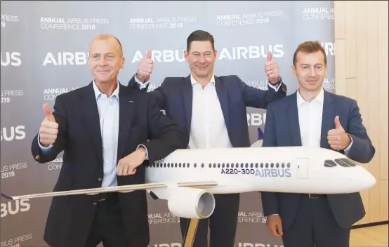  ??  ?? Airbus CEO Tom Enders (left), CFO Harald Wilhelm and President of Airbus Commercial Aircraft Guillaume Faury, thumb up before the presentati­on of Airbus 2018 results in Toulouse, southern France on Feb 14. The European plane manufactur­er Airbus said Thursday it will stop making its superjumbo A380 in 2021 for lack of customers, abandoning the world’s biggest passenger jetand one of the aviation industry’s most ambitious and most troubled endeavors. (AP)