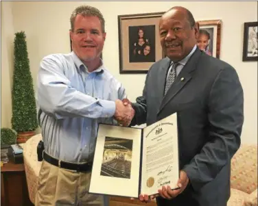  ?? SUBMITTED PHOTO – SADSBURYVI­LLE FIRE COMPANY ?? Sadsburyvi­lle Fire Company Deputy Chief Erik Brecht, left, receives a citation from state Rep. Harry Lewis Jr., R-74, for the company’s 100 years of service.
