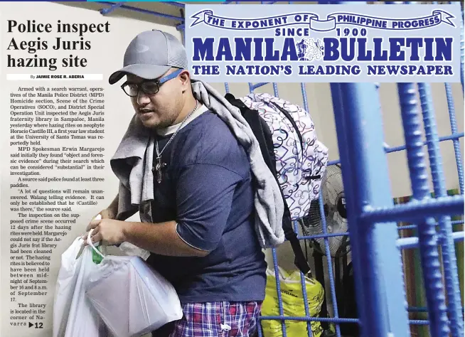  ??  ?? FREE AGAIN – John Paul Solano packs up his things as he prepares to leave the Manila Police District detention cell Thursday following a Department of Justice order to release him. (Ali Vicoy)