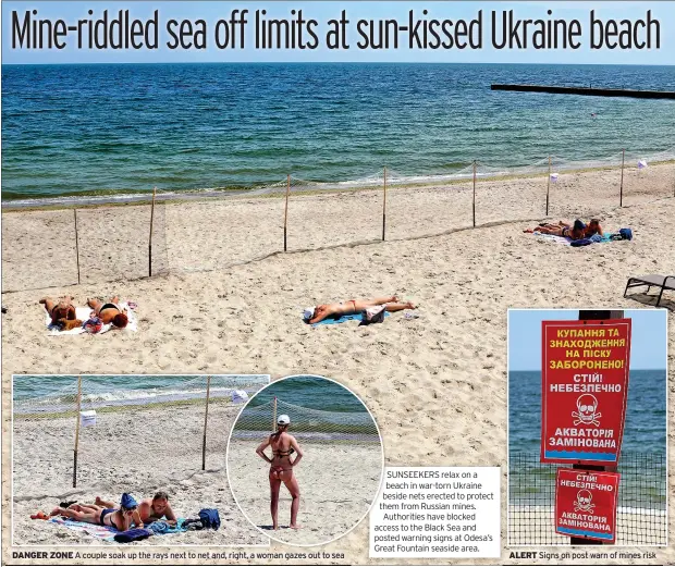  ?? ?? DANGER ZONE A couple soak up the rays next to net and, right, a woman gazes out to sea SUNSEEKERS relax on a beach in war-torn Ukraine beside nets erected to protect them from Russian mines. Authoritie­s have blocked access to the Black Sea and posted warning signs at Odesa’s Great Fountain seaside area.
ALERT Signs on post warn of mines risk