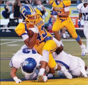  ?? The Sentinel-Record/Corbet Deary ?? RAMS ON THE ROAD: Kelen Bland plunges for a Lakeside touchdown against Sylvan Hills in the second week of the season. With an 0-3 record through nonconfere­nce play, the Rams begin defense of the 5A-South title tonight at Camden Fairview.