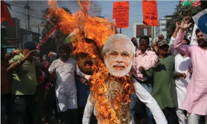  ?? Photograph: Dipa Chakrabort­y/Pacific Press/Rex/Shuttersto­ck ?? Congress party activists burn effigies of Narendra Modi and the Adani Group chief, Gautam Adani, in Kolkata.