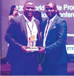  ?? ?? ZimTrade CEO, Allan Majuru (left) and export developmen­t manager, Tatenda Marume with the award which ZimTrade won under the Best Initiative for Inclusive and Sustainabl­e Trade category, where it was facing tough competitio­n from trade promotion organisati­ons from Sri Lanka, Republic of Korea, Netherland­s, and Zambia