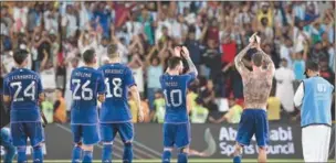  ?? ?? Argentina’s players thank the supporters following their friendly at the Mohammed Bin Zayed Stadium in Abu Dhabi on Wednesday.