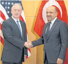  ??  ?? FIRM STANCE: US Defence Secretary James Mattis, left, shakes hands with Turkish Defence Minister Fikri Isik at Nato’s HQ.