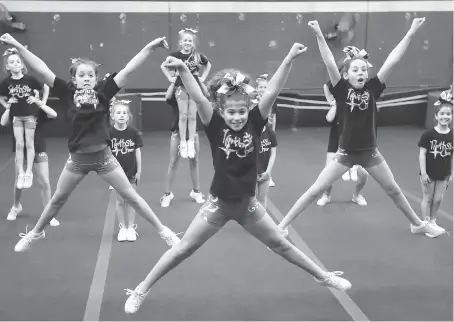  ?? NICK BRANCACCIO ?? Northstar Cheer performers Mikayla Fillion, front left, Daniella Papia and Priya Duba, front right, lead the 16-member team during practice on Saturday. The local cheer team is excited about going to the biggest cheerleadi­ng competitio­n in the United...