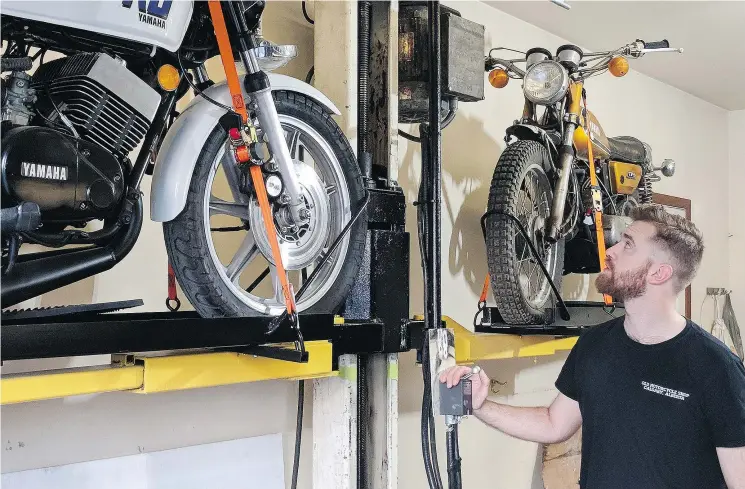  ?? PHOTOS: ANDREA SCHAN ?? A talented fabricator and welder, Ryan Schan built his motorcycle storage system using a dismantled automobile hoist as a starting point.