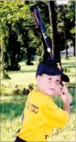  ?? COURTESY PHOTO ?? Backwoods Slugger. Ty Tice has grown up playing baseball and wearing the Black and Gold school colors of Prairie Grove. Here he strikes a pose as a 6-year-old.