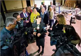  ?? Herald photo by Ian Martens @IMartensHe­rald ?? Minister Shannon Phillips, backed by Mayor Chris Spearman, ARCHES executive director Stacey Bourque, MLA Maria Fitzpatric­k and a group of police and city officials, speaks to reporters Friday inside the city’s future supervised consumptio­n site.