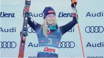  ?? Giovanni Auletta/Associated Press ?? Mikaela Shiffrin celebrates on the podium after winning the women’s World Cup giant slalom race.