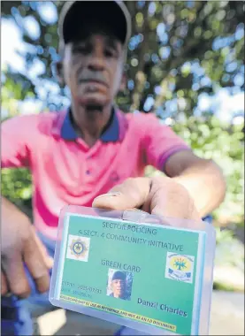  ?? PHOTO: SHELLEY CHRISTIANS ?? SLAMMED: Danzil Charles of Panorama, Worcester, Western Cape, with the green card that allows him to work in the area without being harassed by police