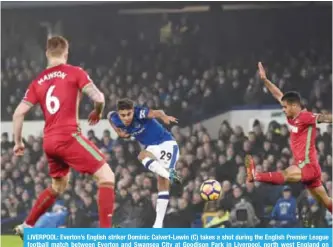  ??  ?? LIVERPOOL: Everton’s English striker Dominic Calvert-Lewin (C) takes a shot during the English Premier League football match between Everton and Swansea City at Goodison Park in Liverpool, north west England on Monday.— AFP