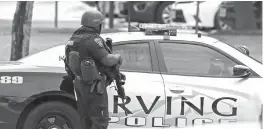  ?? The Dallas Morning News via AP ?? An officer works at a shooting scene on the North Lake College campus Wednesday in Irving, Texas. The situation prompted a lockdown at the school in the Dallas suburb.