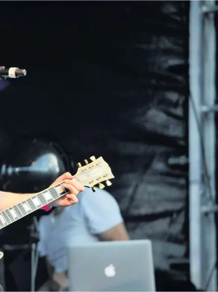  ??  ?? Ian Dench playing with EMF at the Sportbeat Festival in Gloucester in 2016, right, at London’s Scala in 2007 and at work. He co-wrote the song Beautiful Liar with young singer Amanda Ghost for superstars Beyonce, left, and Shakira