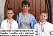  ?? Aliaksandr Sianchuk and Artsiom Sakalou from Chernobyl with host Kathleen O’Rahilly, Knocknagre­e ??