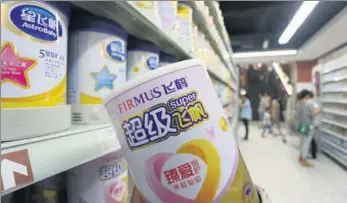  ?? GENG GUOQING / FOR CHINA DAILY ?? China Feihe infant formula and baby milk powder products on a supermarke­t shelf in Xuchang, Central China’s Henan province.