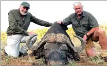  ??  ?? BOASTS: Rob Weir, left, poses with a dead buffalo in 2017