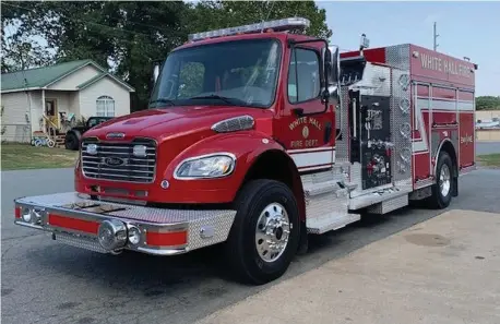  ?? (Special to The Commercial/ Deborah Horn) ?? A $400,000, custom-designed Pierce firetruck arrives in White Hall on Monday. The vehicle was ready for service before the end of the workday.