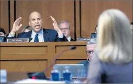  ?? Jose Luis Magana Associated Press ?? SEN. CORY BOOKER (D-N.J.) confronts Homeland Security Secretary Kirstjen Nielsen over her recollecti­ons of the president’s remarks at a DACA meeting.