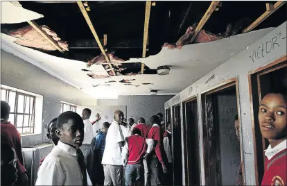  ?? PHOTOS: THULANI MBELE ?? DISGUSTING: The boys ’ toilets at Mandisa Shiceka Secondary. Cigarette butts lie around, the toilets are blocked and have no doors, the ceiling is shattered, and the sinks have no water