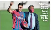  ?? ?? Welcome… Laporta presents Barca’s newest signing at the Nou Camp