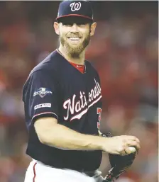  ?? ROB CARR/GETTY IMAGES ?? Stephen Strasburg, pictured, will be on the mound in Game 2, Nationals’ general manager Mike Rizzo said Friday. Max Scherzer is expected to start the opening game.