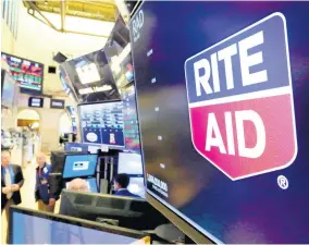  ?? AP ?? The logo for Rite Aid is displayed above a trading post on the floor of the New York Stock Exchange.