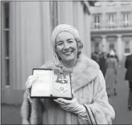  ?? PA VIA AP, FILE ?? Singer Vera Lynn poses Dec. 2, 1975, outside Buckingham Palace after being invested a Dame Commander of the British Empire. The family of World War II forces’ sweetheart Vera Lynn says she has died. She was 103 it was reported on Thursday.