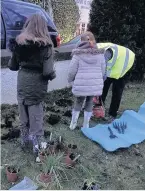  ??  ?? Hard at work Some of the Brownies help brighten up Eaglesham