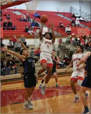  ?? PAUL DICICCO — FOR THE NEWS-HERALD ?? Steven Key of Mentor hits a shot during the Cardinals’ 9072 win over Brunswick on Jan. 22.