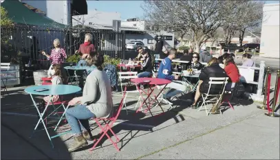  ?? PHOTOS BY KAREN RIFKIN ?? Locals and visitors enjoy the beer garden at the Ukiah Brewing Company on Saturday – dancing and listening to live music, eating and drinking.