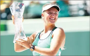  ??  ?? Victoria Azarenka of Belarus holds aloft the Butch Buchholz trophy after her straight sets victory against Svetlana Kuznetsova of Russia in the womens final during the Miami Open Presented by Itau at Crandon Park Tennis Center on April 2 in Key Biscayne, Florida. (AFP)