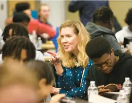  ?? STEPHEN M. KATZ /STAFF ?? Norfolk City Councilwom­an Andria McClellan chats over lunch with high school students during Wind Energy Rocks 2 on Oct. 25, 2022. McClellan has announced she will not seek reelection.