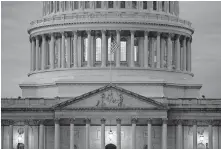  ?? FILE PHOTO] ?? In this May 3 photo, light shines from inside the U.S. Capitol dome at dusk on Capitol Hill in Washington. [PATRICK SEMANSKY/ASSOCIATED PRESS