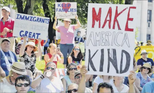  ?? Photos by John Carl D’annibale / Times Union ?? Demonstrat­ors at the state Capitol in Albany take part Saturday in the People for the American Way’s nationwide day of protest against the Trump administra­tion’s treatment of immigrants.