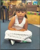  ?? CONTRIBUTE­D BY HIGH MEADOWS SCHOOL ?? Lula Nicholson, 4, practices mindfulnes­s at High Meadows School in Roswell.