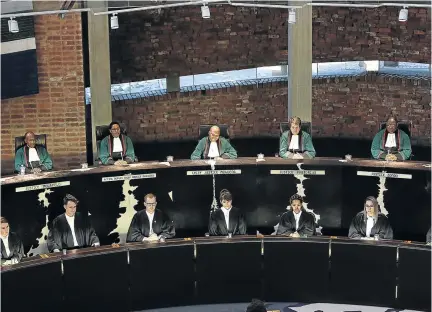  ?? / ALON SKUY/THE TIMES ?? Chief Justice Mogoeng Mogoeng and the rest of the Constituti­onal Court judges during the ruling on the Sassa grant payment system on March 17 .