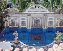  ??  ?? Joey Cargill of Manila, from the Philippine­s, left, and David Tamuty of Fort Lauderdale, Fla., lounge in the swimming pool lined with 24-karat gold tiles at The Villa Casa Casuarina in Miami Beach, Fla.