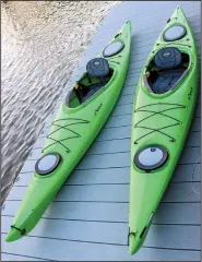  ??  ?? Kayaks await
their pilots at twilight in August at Rockwater Marina on the Arkansas River.